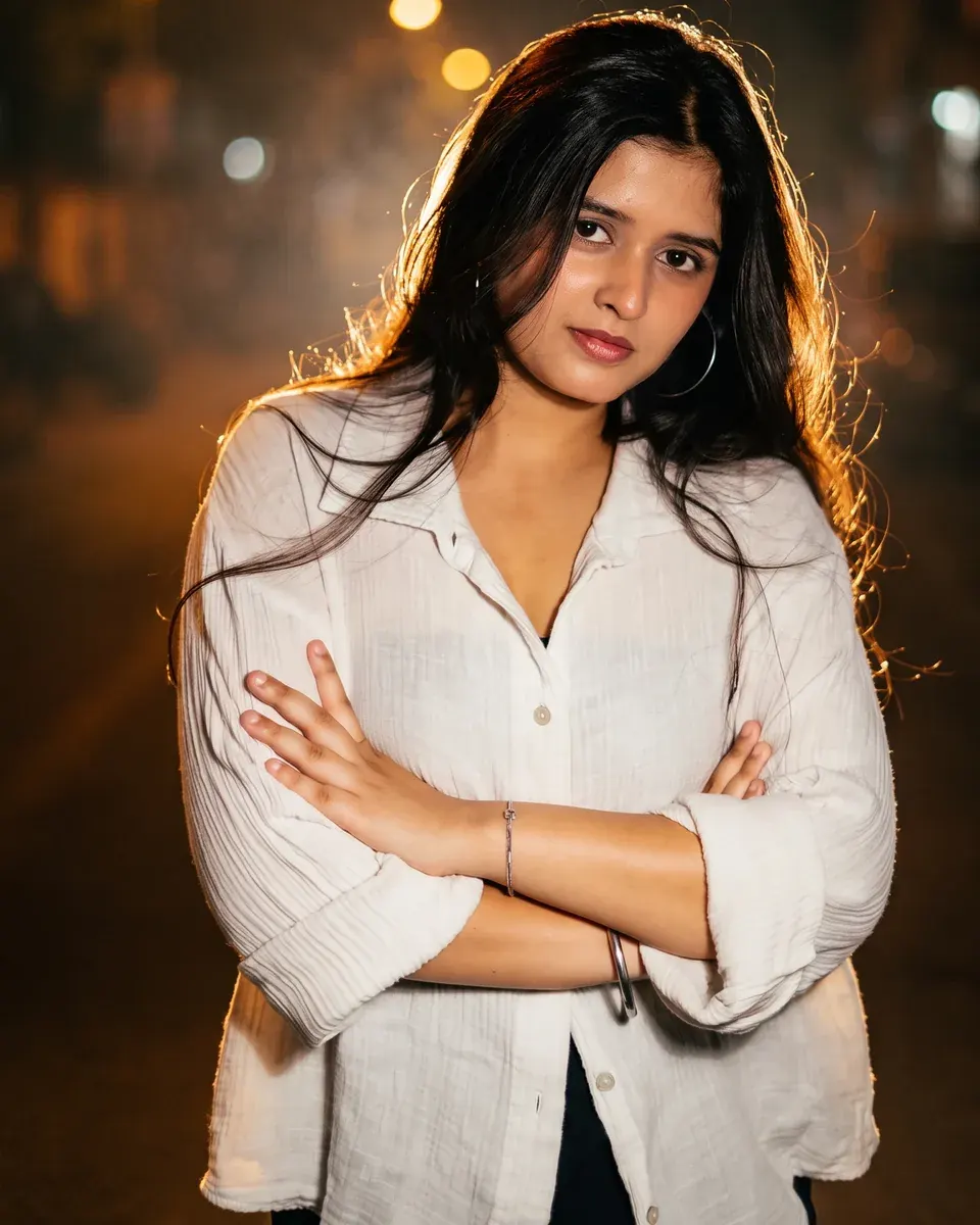 Real Oranokai AI relight output — cinematic warm backlight with lens bloom, shallow depth of field, and a softly blurred night street background